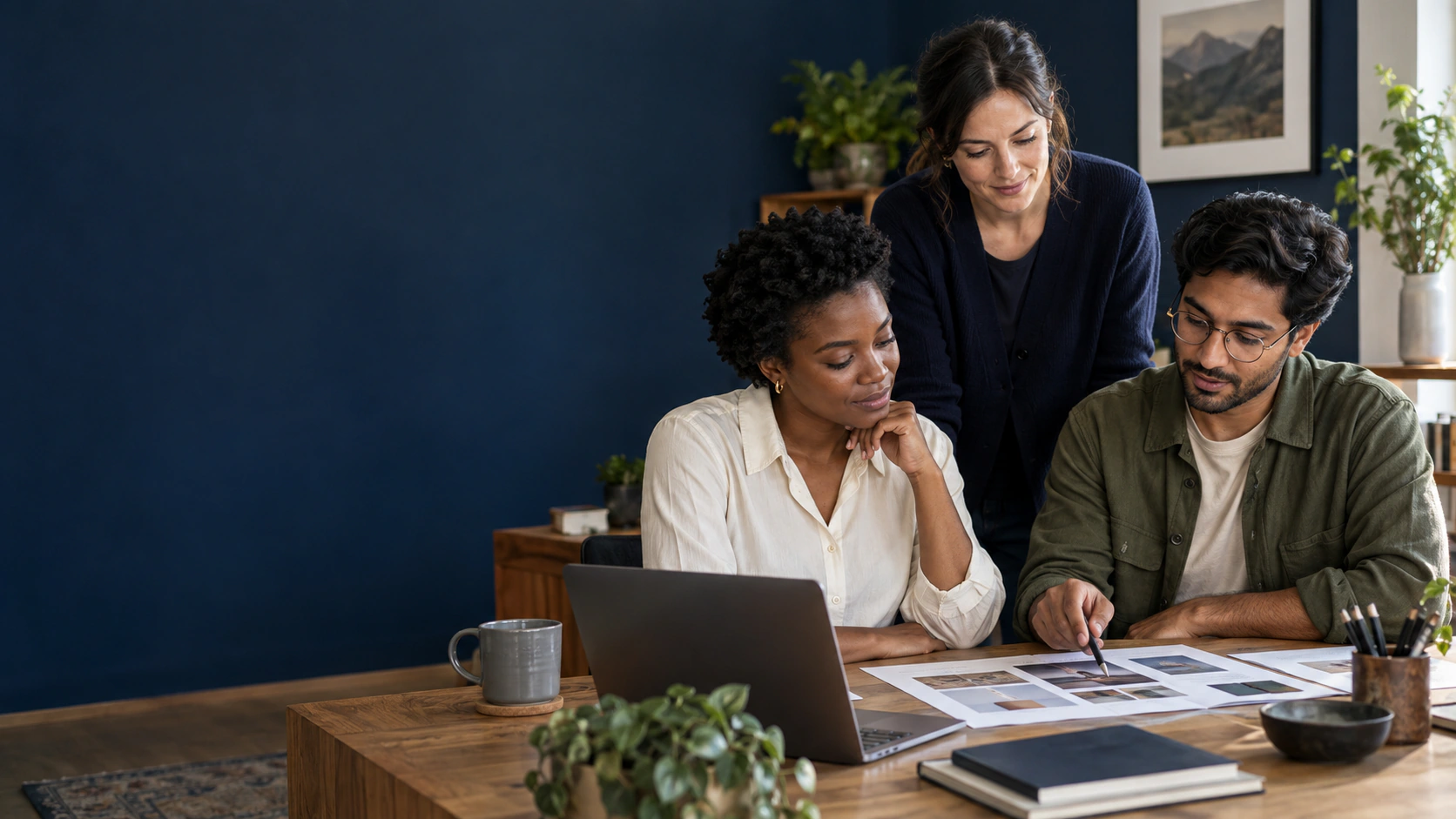 Illustrative scene of a small creative team discussing a website project in a studio